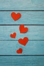 Red paper hearts on a blue wooden background Royalty Free Stock Photo