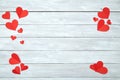 Red paper hearts on white wood Valentine& x27;s Day