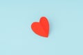 Red paper origami heart on blue background . Royalty Free Stock Photo