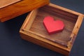 Red paper origami heart inside wooden box Royalty Free Stock Photo