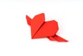 Red paper origami heart with wings on white background . Royalty Free Stock Photo