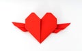 Red paper origami heart with wings on white background . Royalty Free Stock Photo