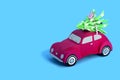 Red paper retro car carries Christmas tree Royalty Free Stock Photo