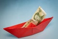 Red paper ship with Chinese yuan, China money, Economic concept, Chinese currency strength, Shipping world markets Royalty Free Stock Photo