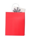 Red paper shopping bag with gift box on white background Royalty Free Stock Photo