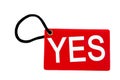 Red paper tag labeled with yes words Royalty Free Stock Photo