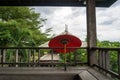 Red paper umbrella in traditional Lanna house