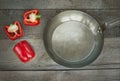 Red Paprika and dripping pan on vintage wooden board. Top view, copy space. Royalty Free Stock Photo