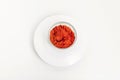 Red paprika in a glass plate on a white background Royalty Free Stock Photo