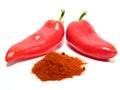 Red paprikas and ground paprika Royalty Free Stock Photo