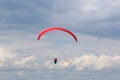 Red paraglider in a blue sky Royalty Free Stock Photo