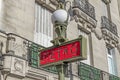 Red Paris Metro subway sign with street lamp Royalty Free Stock Photo