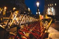 Red parked rental bikes at night perspective shot