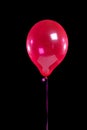 Red party balloon on black Royalty Free Stock Photo