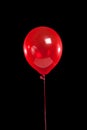 Red party balloon on black Royalty Free Stock Photo