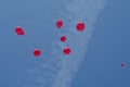 8 red party balloons floating in the blue sky Royalty Free Stock Photo