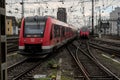 Red passenger train arriving at Cologne central station. Royalty Free Stock Photo