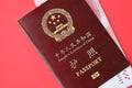 Red passport of People Republic of China and chinese yuan money bills. PRC chinese passport Royalty Free Stock Photo