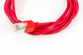 Red patch cable with RJ45 connector isolated on white background Royalty Free Stock Photo