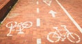 Red paved bike path or a bike is painted in white paint Royalty Free Stock Photo