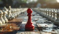 Red pawn chess piece stands alone on a damaged chessboard with rows of white pieces image Royalty Free Stock Photo