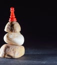 red pawn on stone top view