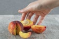 A red peach sliced on the table