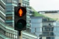 Red pedestrian signal. Traffic light female figure shape in one of avenue in Vilnius, Lithuania