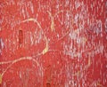 Red peeling paint with yellow grafetti Royalty Free Stock Photo