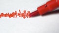 Red pen draws on white page frequency, seismogram