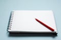 Red pen notebook in blur Royalty Free Stock Photo