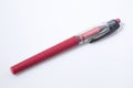 Red pen in a white background composition Royalty Free Stock Photo