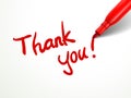 Red pen writing thank you over document Royalty Free Stock Photo