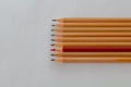 Red pencil and black pencils on white background Royalty Free Stock Photo