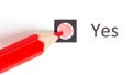 Red pencil choosing between yes or no Royalty Free Stock Photo