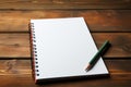 Red pencil and notepad on a wooden table for jotting goals and tasks