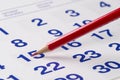 Red pencil over calendar Royalty Free Stock Photo