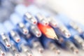 Red pencil in Plenty of blue pens Royalty Free Stock Photo