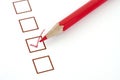 Red pencil and questionnaire on white paper. Royalty Free Stock Photo