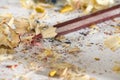 Red pencil with sharpener shaves Royalty Free Stock Photo