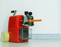 Red Pencil Sharpener on White Pattern Background Royalty Free Stock Photo