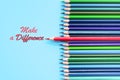 Red pencil standing out on blue background. Leadership, uniqueness, independence, initiative, strategy, dissent, think different, Royalty Free Stock Photo