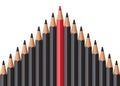 Red pencil standing out from crowd of plenty identical black fellows on white table Royalty Free Stock Photo