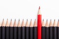 Red pencil standing out from crowd Royalty Free Stock Photo