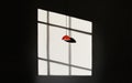 Red Pendant Lamp Shadow on Gridded Window Wall Royalty Free Stock Photo