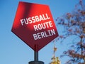 Red pentagonal football sign on blue sky background