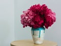 Red peonies in a handmade vase