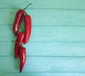 Red pepper on a blue wooden background cayenne spice Royalty Free Stock Photo