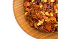 Red Pepper Flakes in Wood Bowl Royalty Free Stock Photo