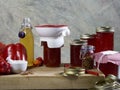 Red pepper jelly canning preserving equipment and the filled jars Royalty Free Stock Photo